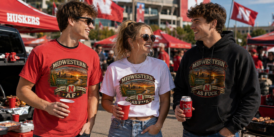 Three friends at a Huskers tailgate in all three Nebraska editions: red AF tee, white As F**K tee, black As Fuck hoodie