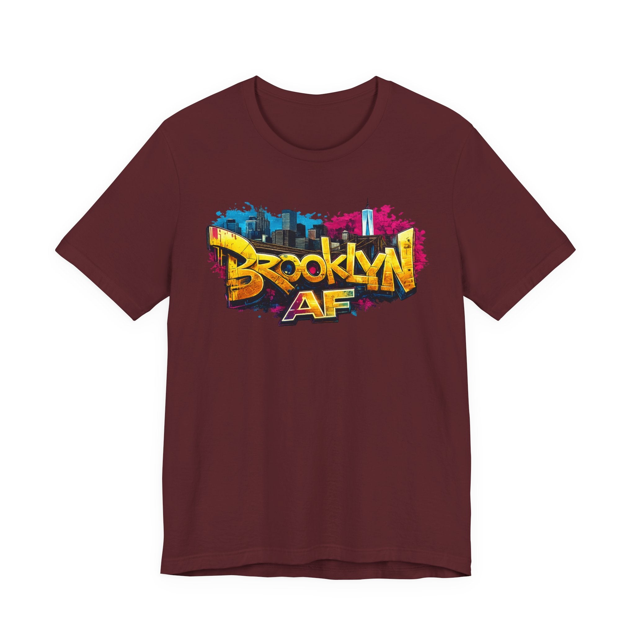 Maroon t-shirt, front view flat lay, featuring graffiti Brooklyn AF lettering over a skyline paint-splash design.