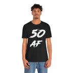 Man in the black 50 AF birthday t-shirt and jeans, front view on a plain backdrop