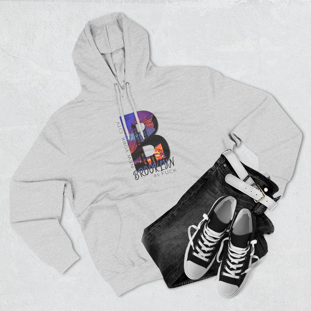 Heather grey hoodie, flat lay styled with jeans and sneakers, showing the 'B' Brooklyn skyline graphic and 'As Fuck' text.