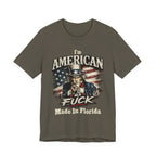 Olive green t-shirt laid flat, showing the Uncle Sam graphic pointing forward with flag backdrop