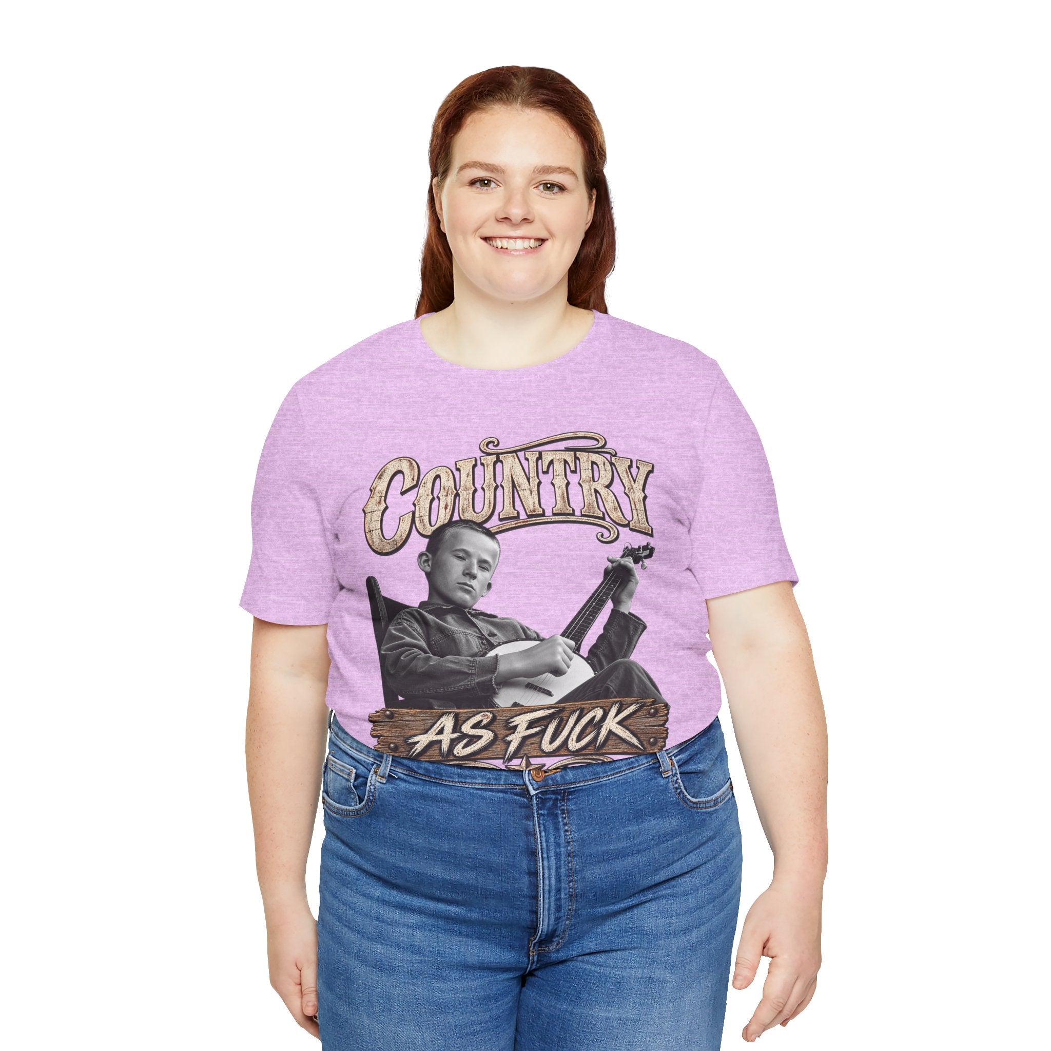Woman in the Heather Prism Lilac Country As Fuck tee and blue jeans