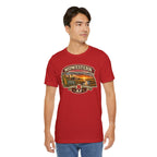 Man wearing the red Nebraska tee, vintage Nebraska farm graphic printed on the front