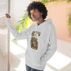 Woman wearing heather grey Missouri Midwestern As Fuck hoodie, standing by a window