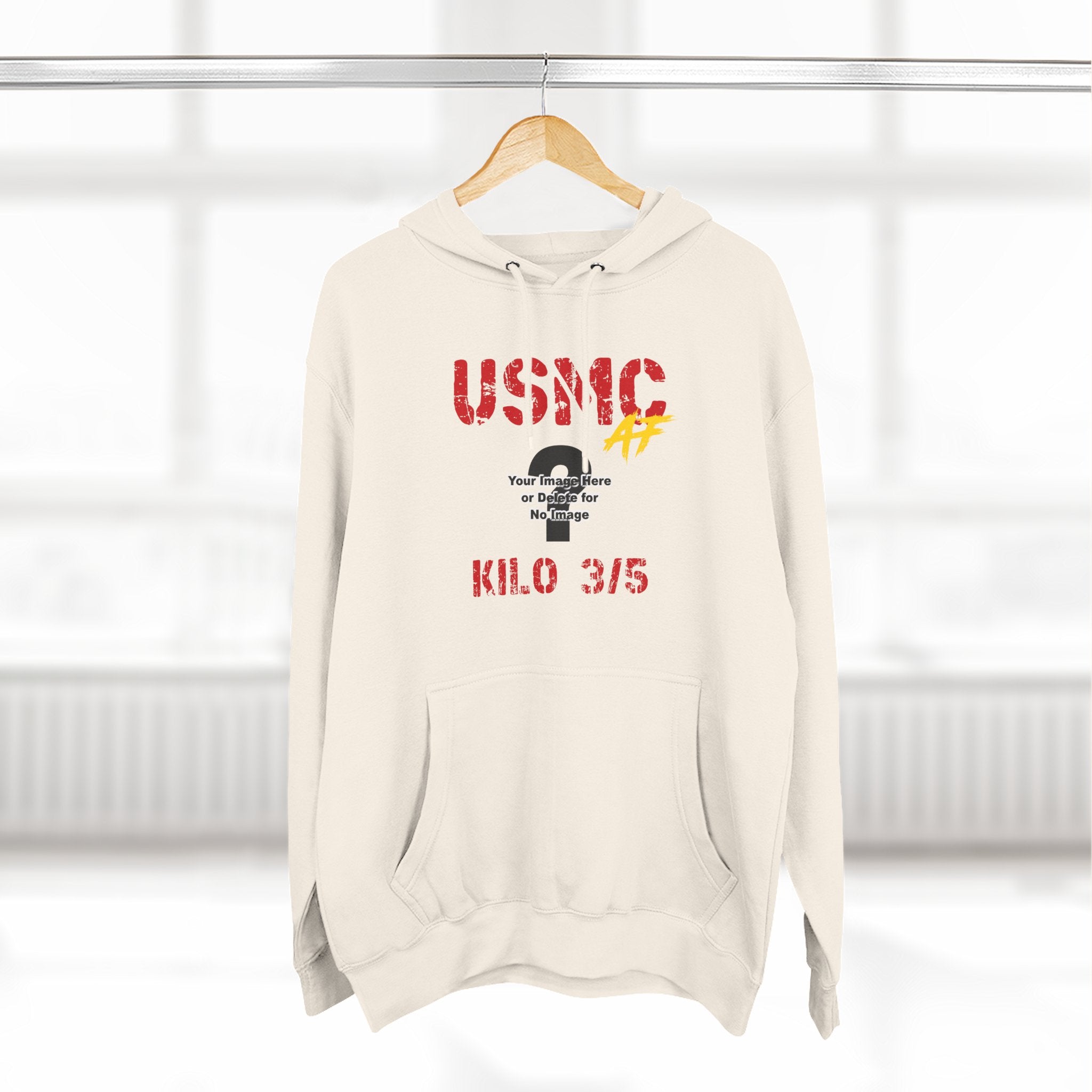 Personalized USMC Marine Corps AF hoodie in Sandshell on a hanger, front view with red USMC lettering