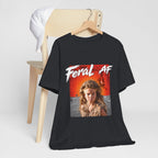 Vintage Black Feral AF T-shirt on a wooden hanger beside a chair, front print facing out