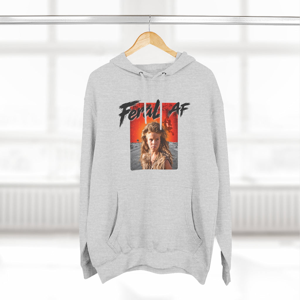 Heather Grey Feral AF hoodie on a wooden hanger by a bright window, front print facing out