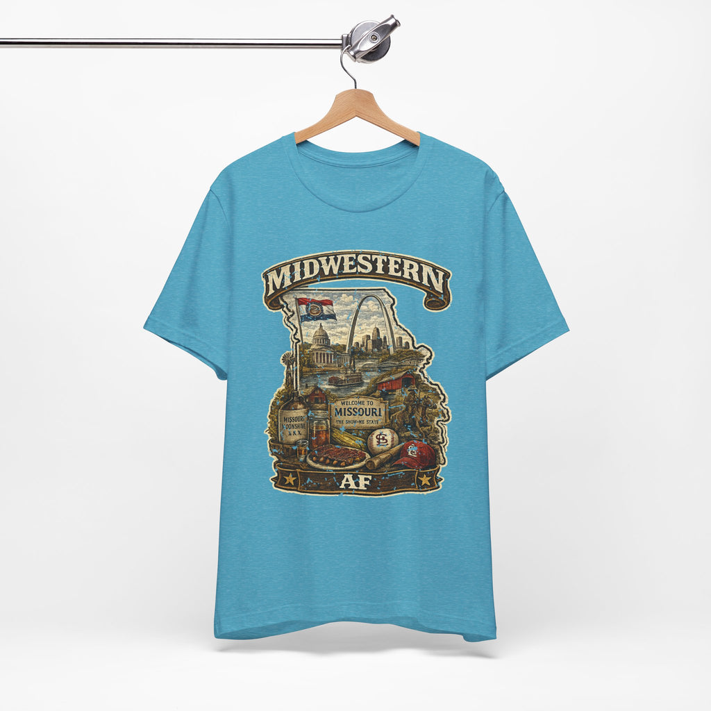 Heather aqua Missouri Midwestern AF t-shirt hanging on a wooden hanger, vintage Show-Me State graphic design
