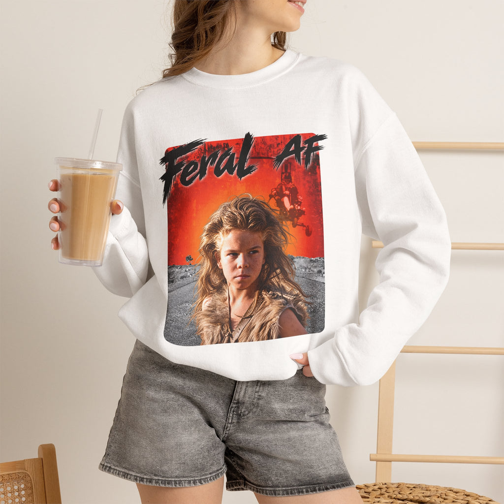 Woman wearing the White Feral AF sweatshirt with denim shorts, holding an iced coffee