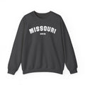 Dark heather Missouri crewneck laid flat, white varsity MISSOURI lettering over SHOW ME