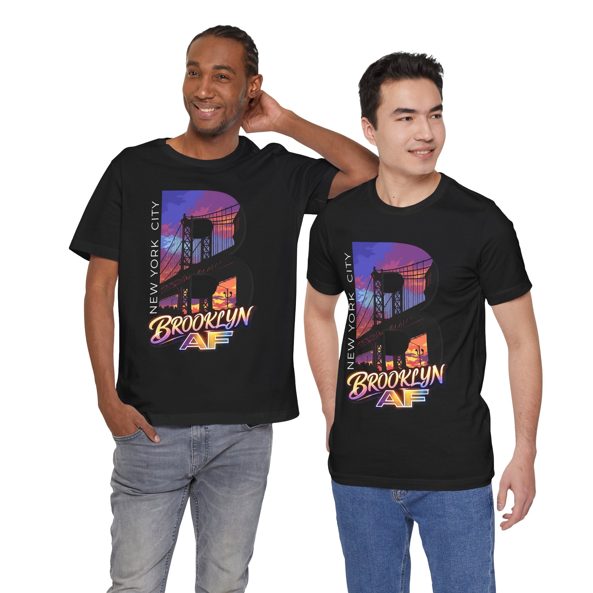 Black t-shirts worn by two male models, front view, each with a purple-orange Brooklyn Bridge sunset B graphic.