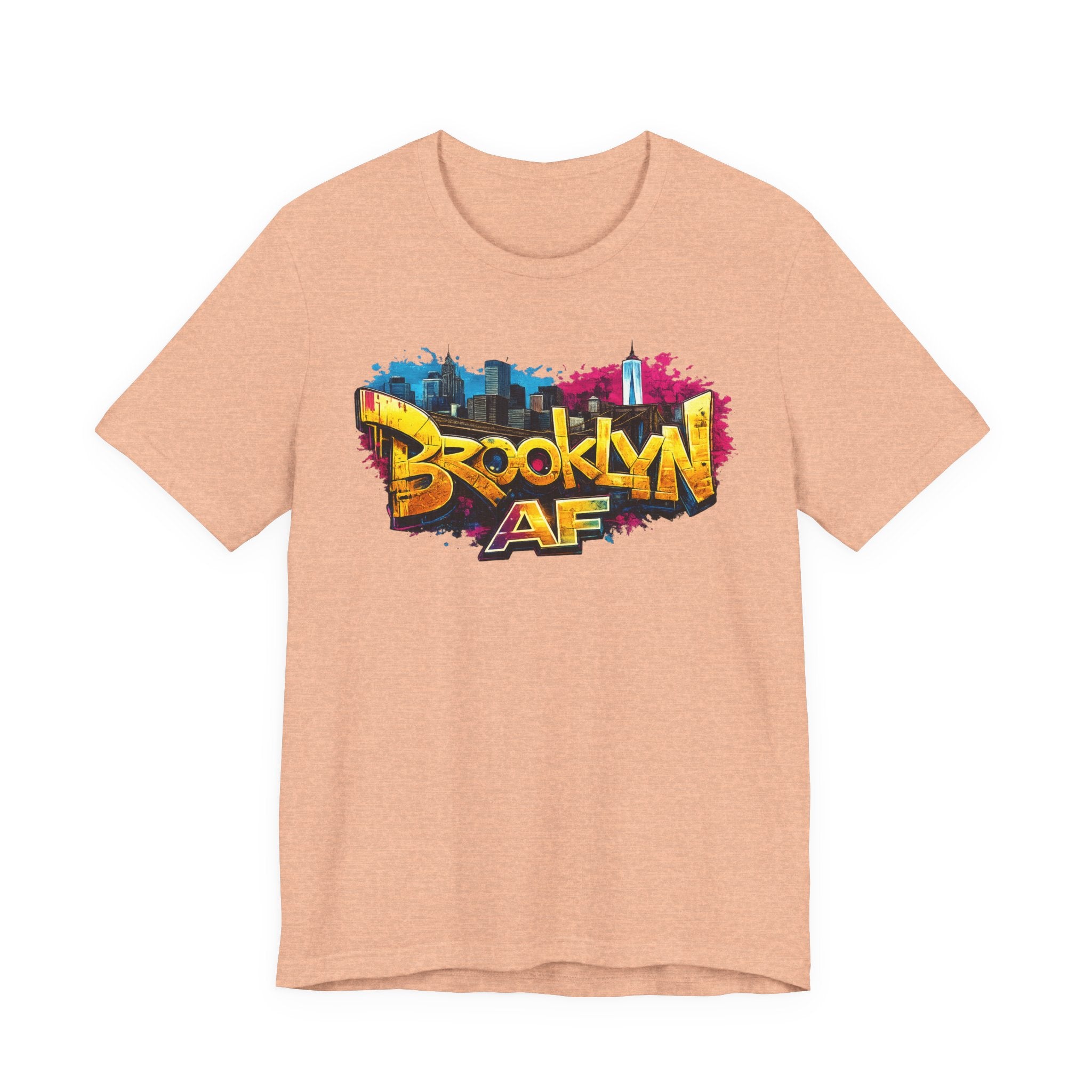 Heather Peach t-shirt, front view flat lay, showing graffiti-style Brooklyn AF lettering over a skyline paint splash.