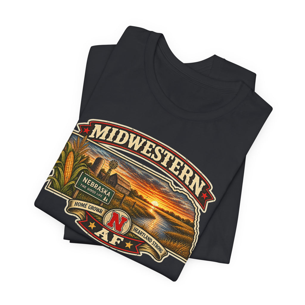 Folded vintage black Nebraska tee showing the Midwestern banner and sunset artwork up close