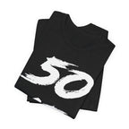 Folded black birthday tees stacked, the white 50 filling the top fold