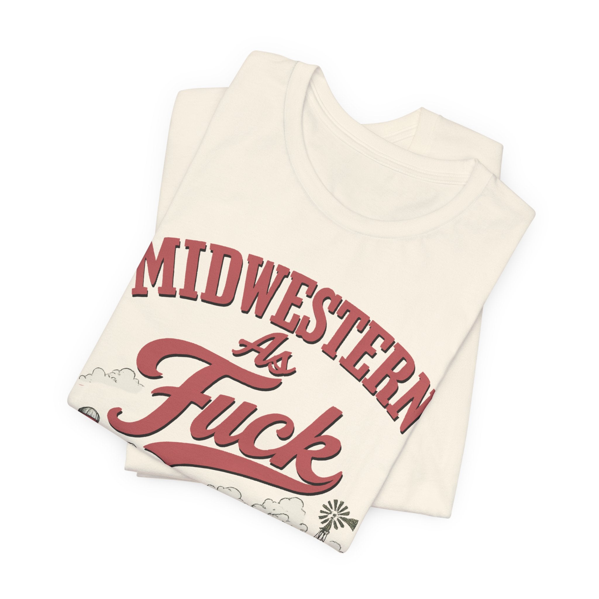 Natural colored Midwestern As Fuck t-shirt folded, close-up angled view of the text and farm graphic.