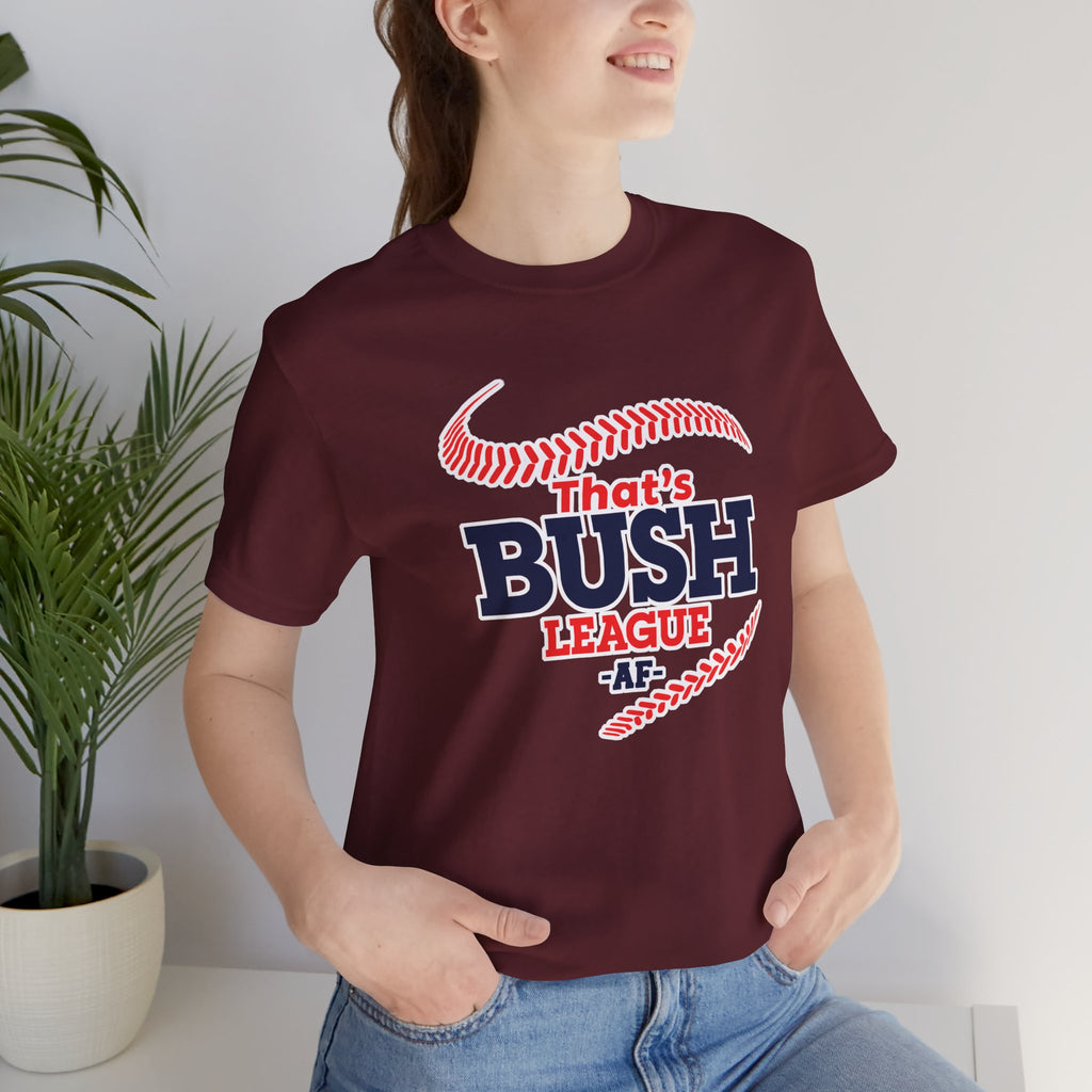 Woman wearing the Maroon Bush League AF tee indoors beside a houseplant