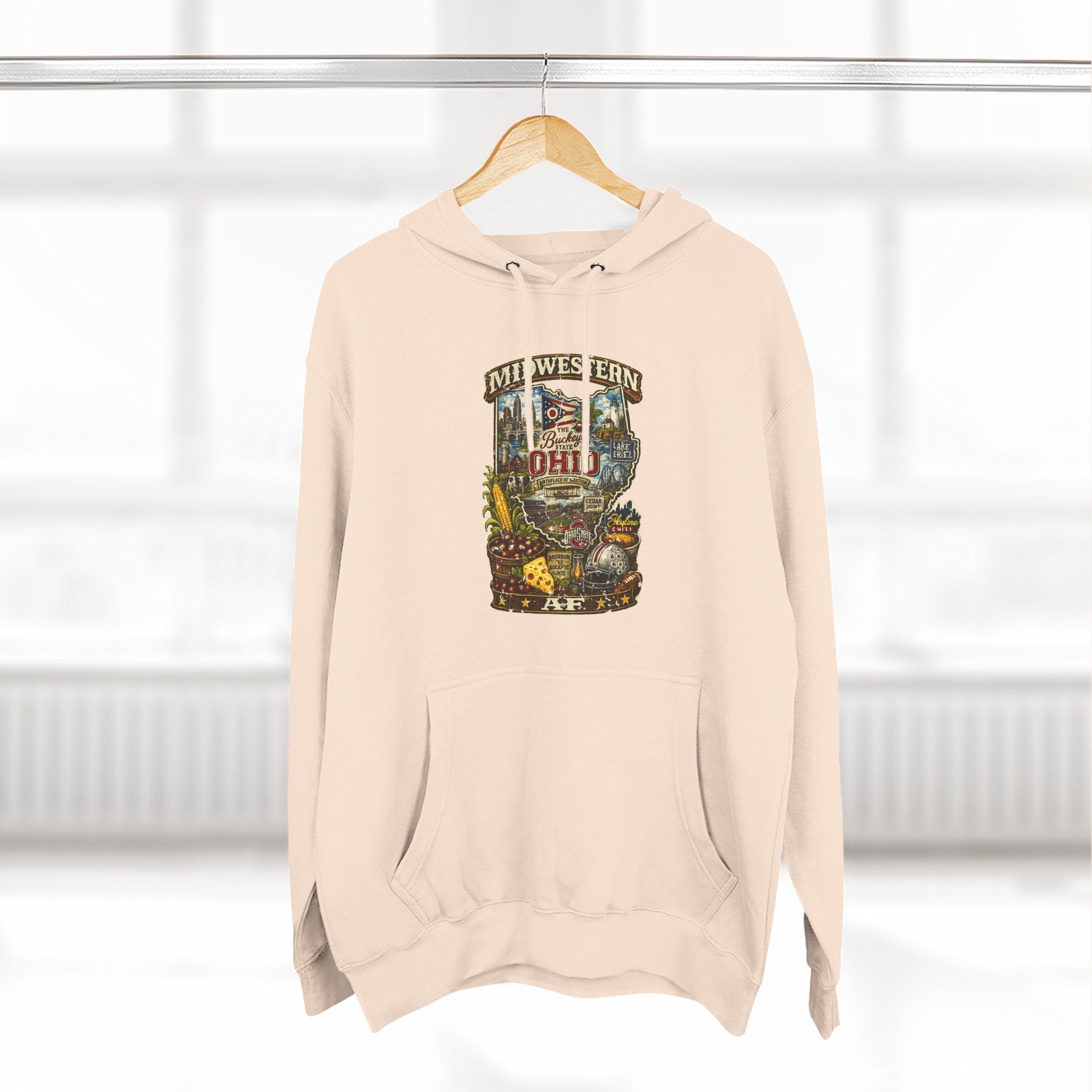 Oatmeal Ohio Midwestern AF hoodie hanging on a wooden hanger, Buckeye State graphic design