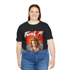 Woman wearing the Vintage Black Feral AF tee, washed black fabric behind the wasteland graphic