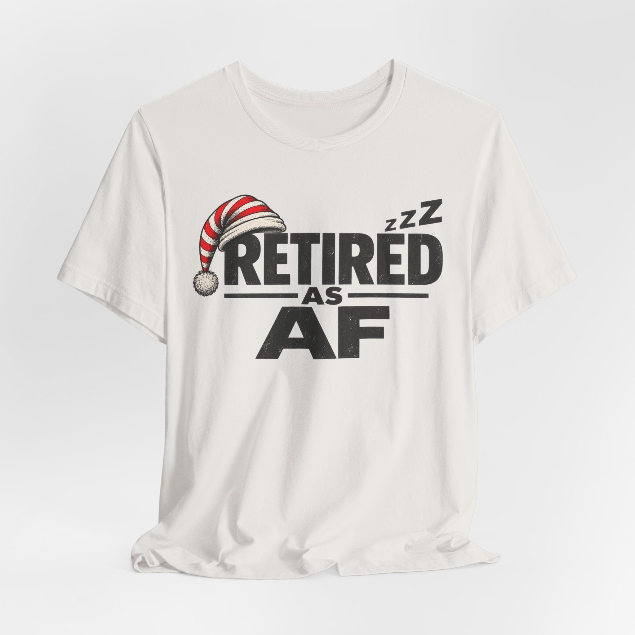 Vintage White Retired AF tee draped loosely, showing the front print on cream fabric
