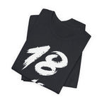 Folded Vintage Black tees stacked with the white 18 across the top fold
