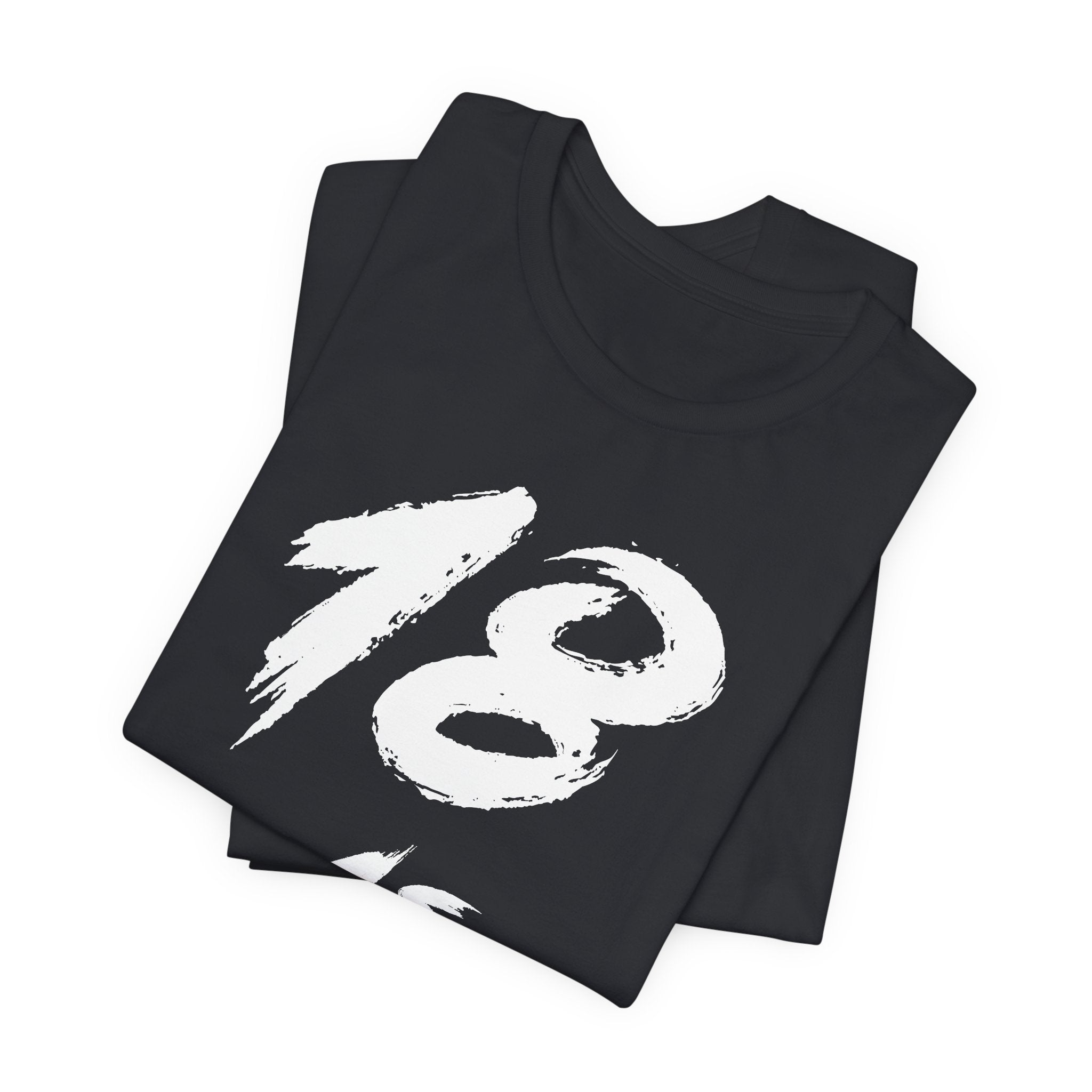 Folded Vintage Black tees stacked with the white 18 across the top fold