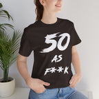 Woman indoors beside a houseplant wearing the dark brown 50 AS F**K birthday tee