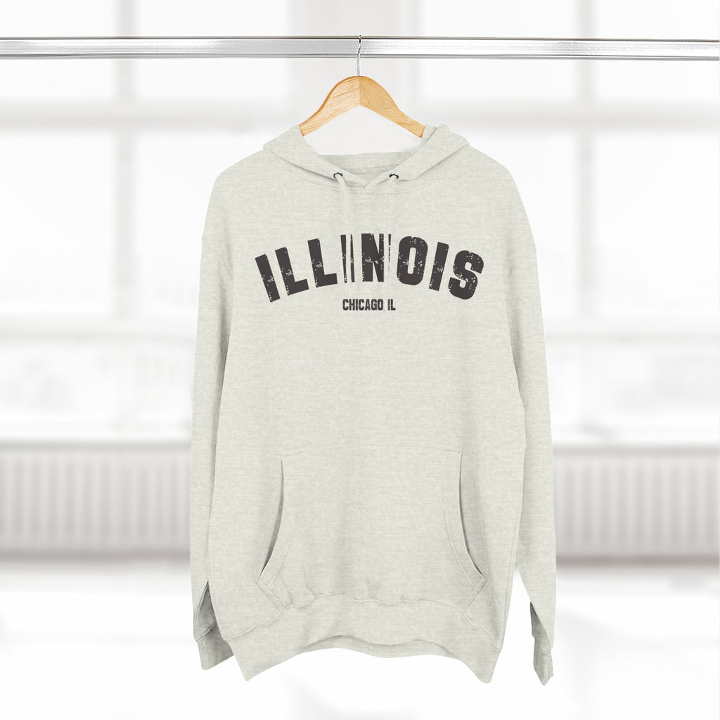 Oatmeal Heather custom Illinois hoodie on a wooden hanger, charcoal varsity ILLINOIS and a Chicago IL line