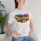 White t-shirt worn by a model, close-up of chest print showing graffiti Brooklyn AF lettering and skyline art.
