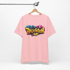 Pink t-shirt on a wooden hanger, front view, showing graffiti-style Brooklyn AF lettering over a skyline paint splash.