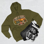 Army green Nebraska hoodie flat-lay with black jeans and white high-top sneakers