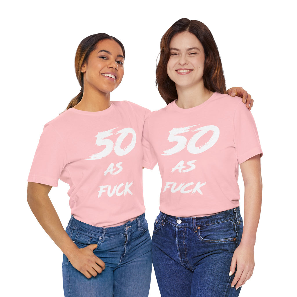 Two women arm in arm in matching pink 50 AS FUCK birthday tees