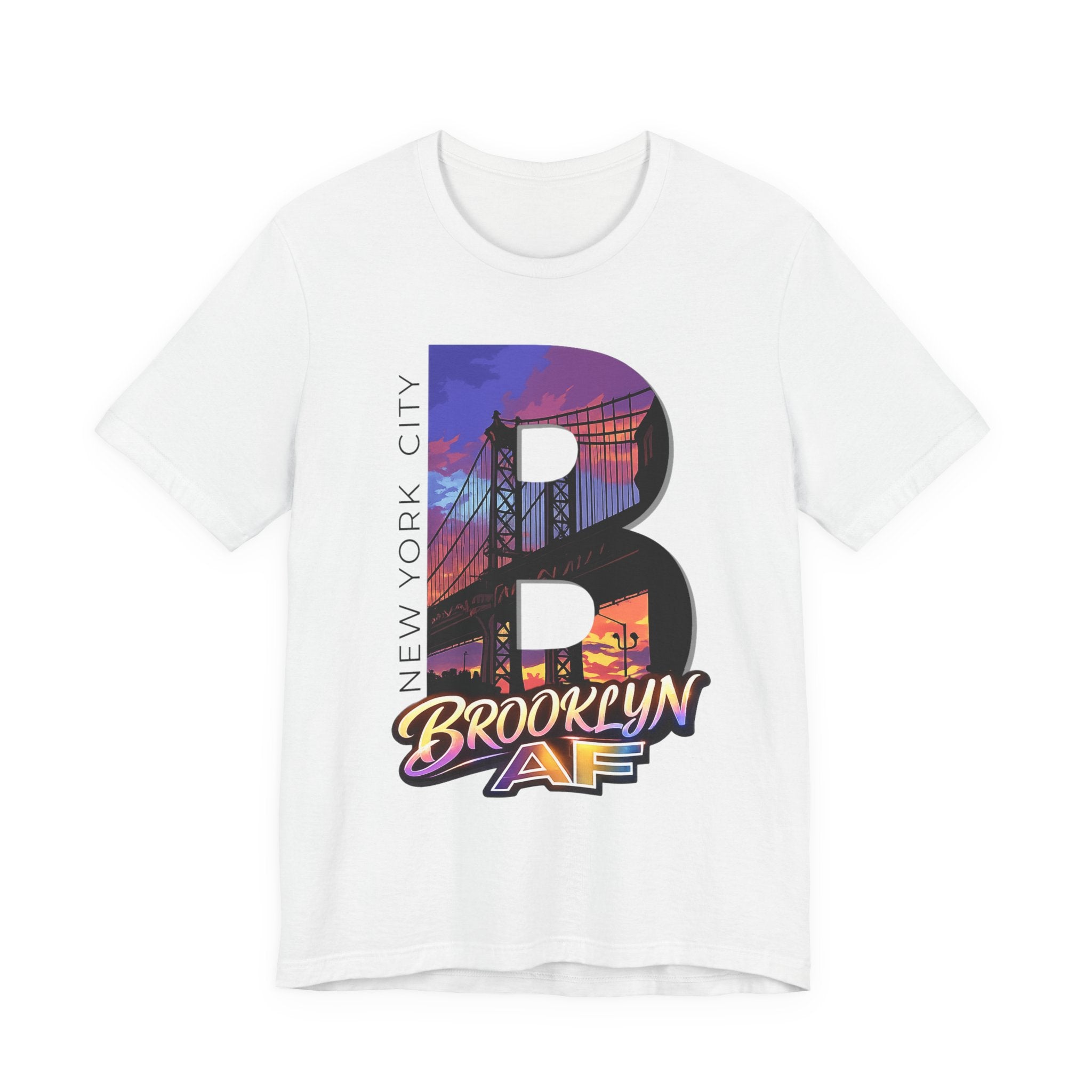 White t-shirt, flat lay on a plain white background, with a bold "B" Brooklyn Bridge sunset skyline graphic.