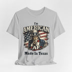 Light gray tee laid flat with relaxed drape, Uncle Sam graphic and 'I'm American AF, Made In Texas' text