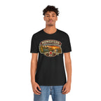 Man wearing the black Nebraska T-shirt with the state-shaped prairie sunset print