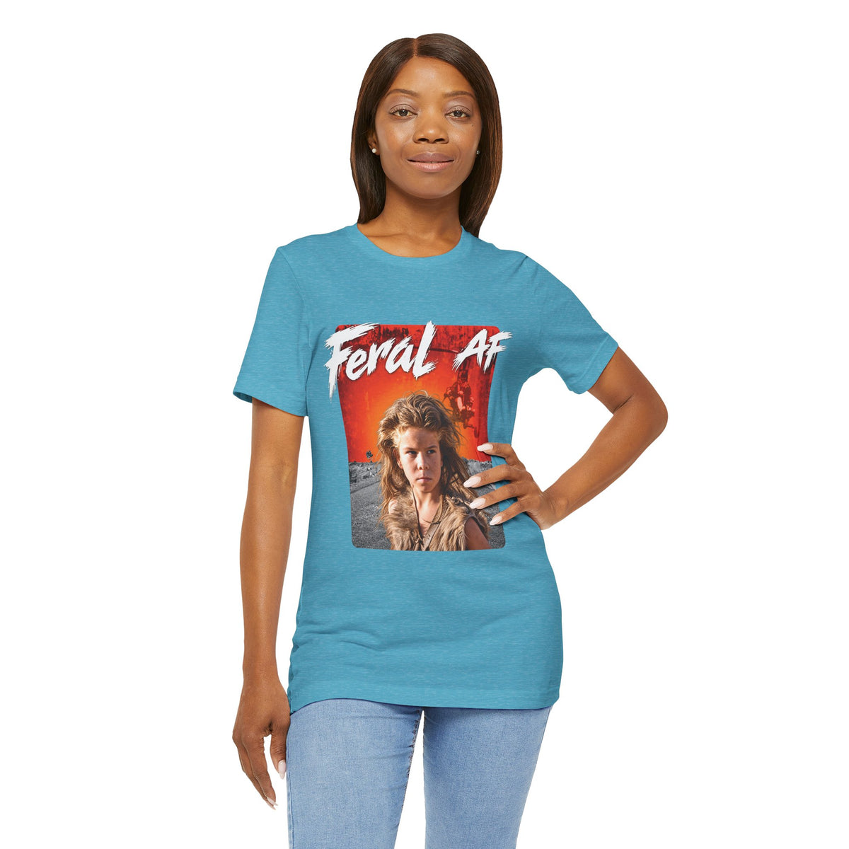 Woman modelling the Heather Aqua Feral AF tee with a hand on her hip, front graphic centred