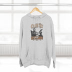 Heather Grey Country AF hoodie hanging on a wooden hanger by a window