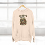 Oatmeal heather Missouri Midwestern As Fuck hoodie hanging on a wooden hanger, Show-Me State graphic design