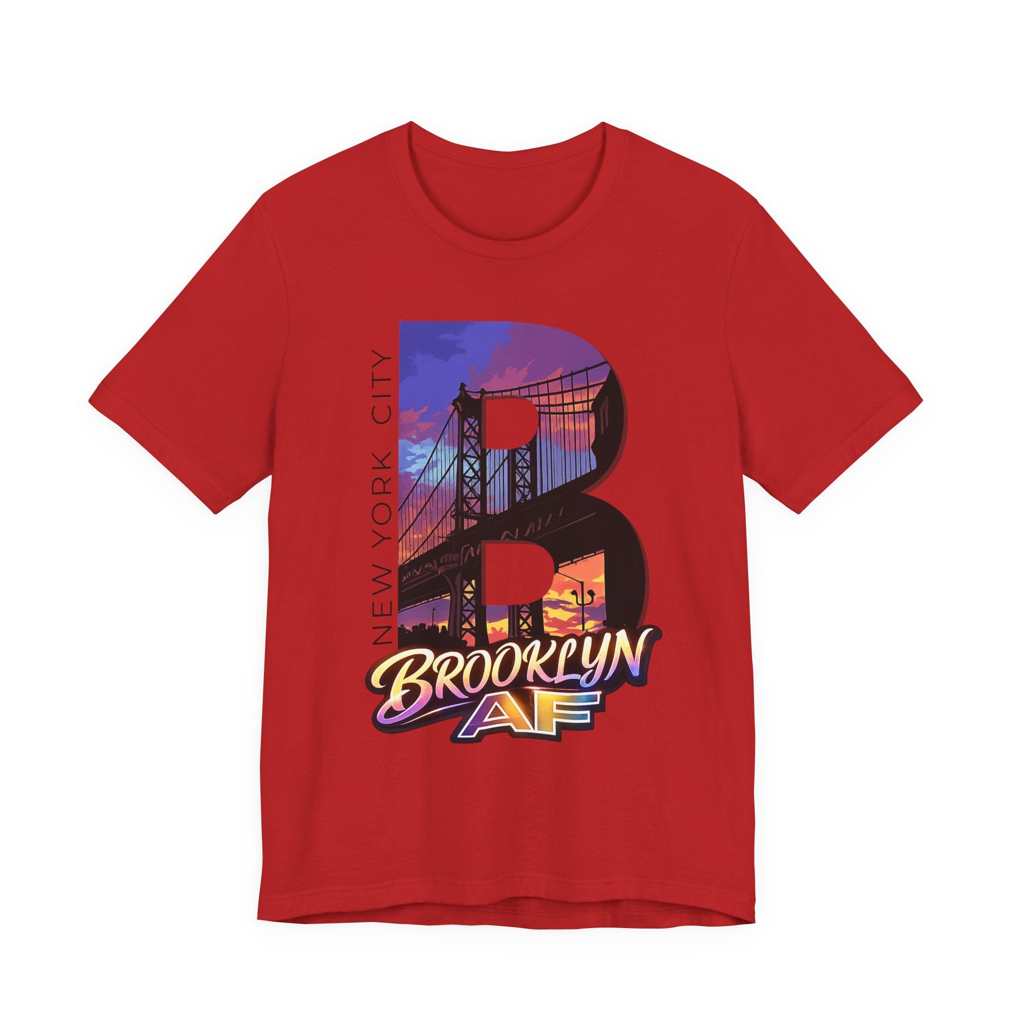 Red t-shirt, flat lay, with a bold oversized "B" featuring a Brooklyn Bridge sunset skyline graphic.