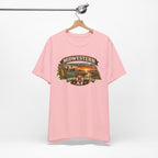 Pink Nebraska tee hanging on a wooden hanger with the Cornhusker State front print
