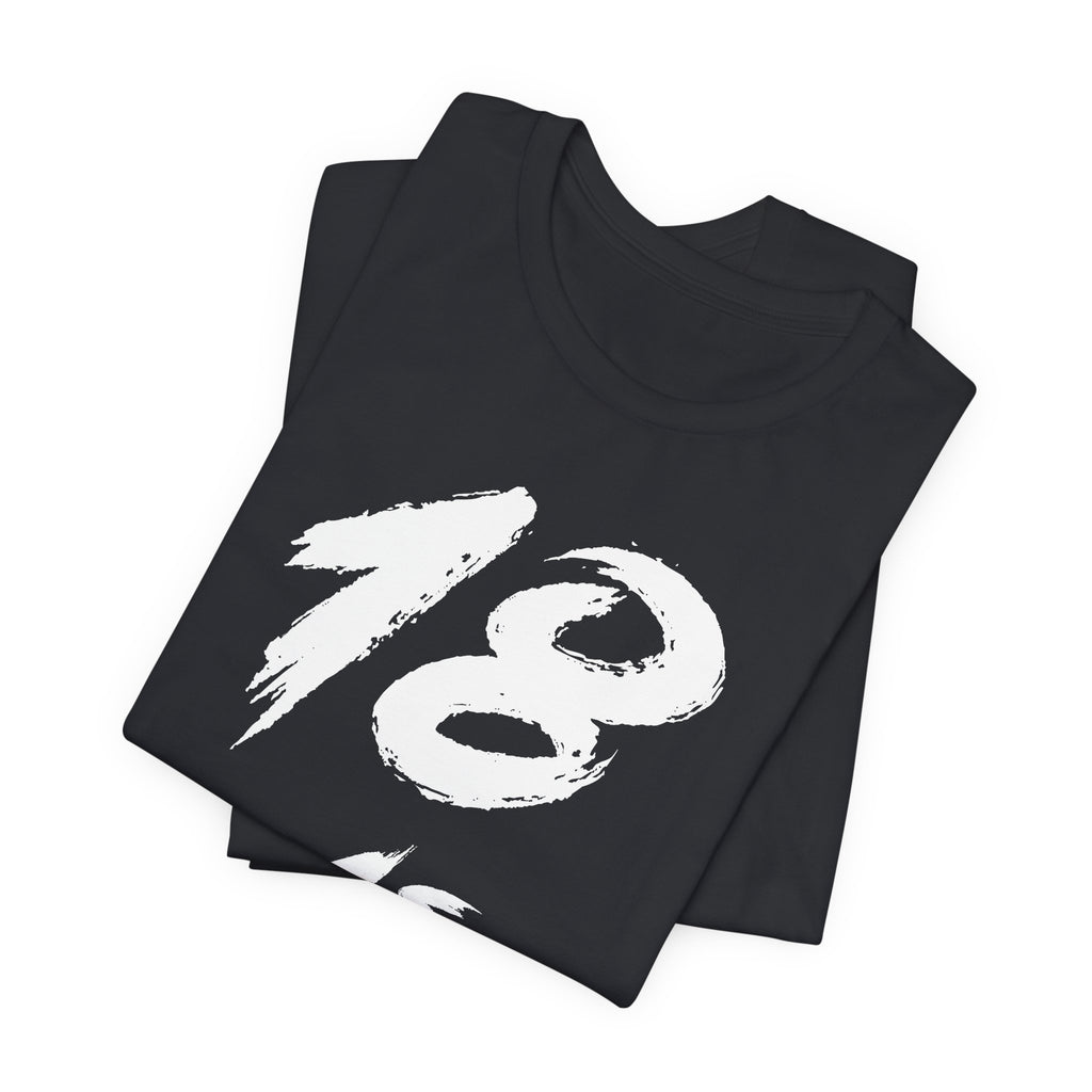 Folded Vintage Black tees stacked with the white 18 across the top fold