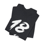 Folded Vintage Black tees stacked with the white 18 across the top fold