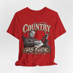 Red Country As Fuck tee laid flat, distressed banjo-player front graphic