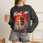 Woman wearing the Dark Heather Feral AF crewneck with an iced coffee, charcoal fabric