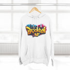 White hoodie hanging on a wooden hanger, showing the colorful graffiti-style Brooklyn AF skyline print.