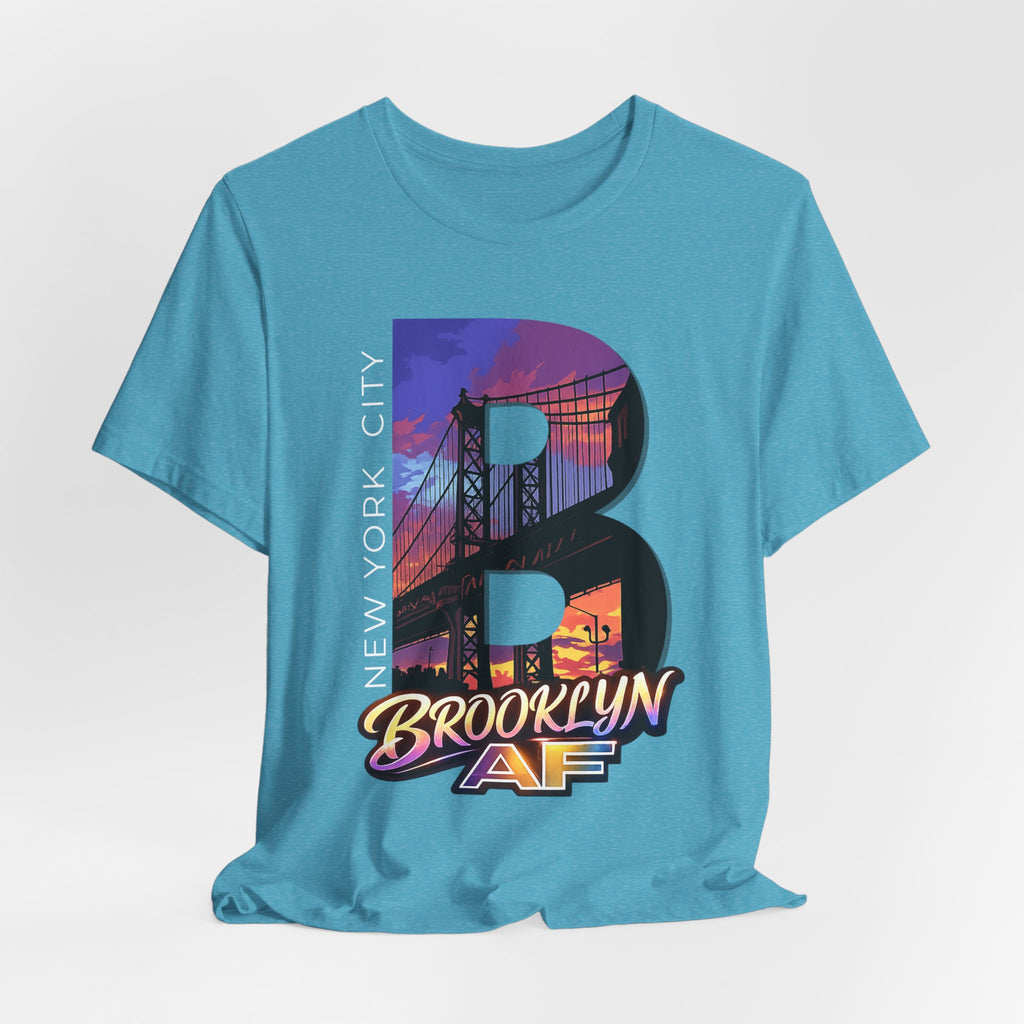 Teal t-shirt flat lay, front view with full 'B' graphic, Brooklyn Bridge sunset skyline and 'Brooklyn AF' logo