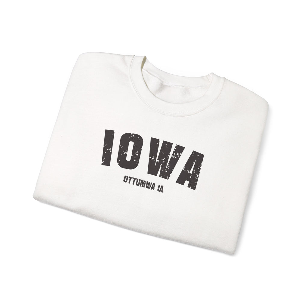 White personalized Iowa crewneck folded, showing the distressed IOWA arch and OTTUMWA IA line