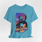 Heather Aqua tee, flat lay, front view, with the oversized "B" Brooklyn Bridge sunset skyline graphic and logo.