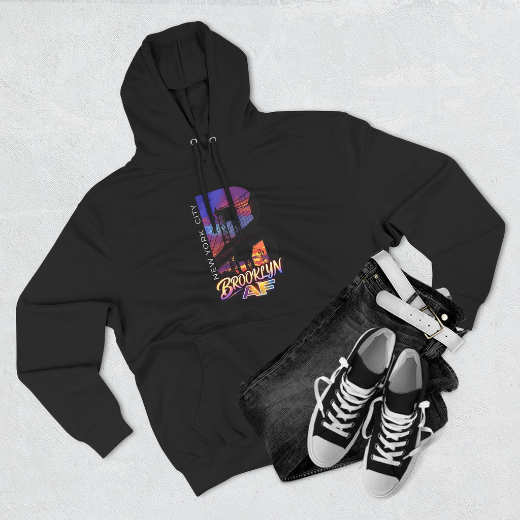 Black hoodie flat lay paired with jeans, a white belt, and sneakers, featuring the oversized "B" skyline graphic.