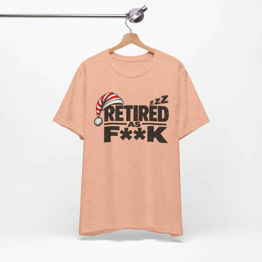 Heather Peach Retired As F**K tee on a wooden hanger against a plain wall