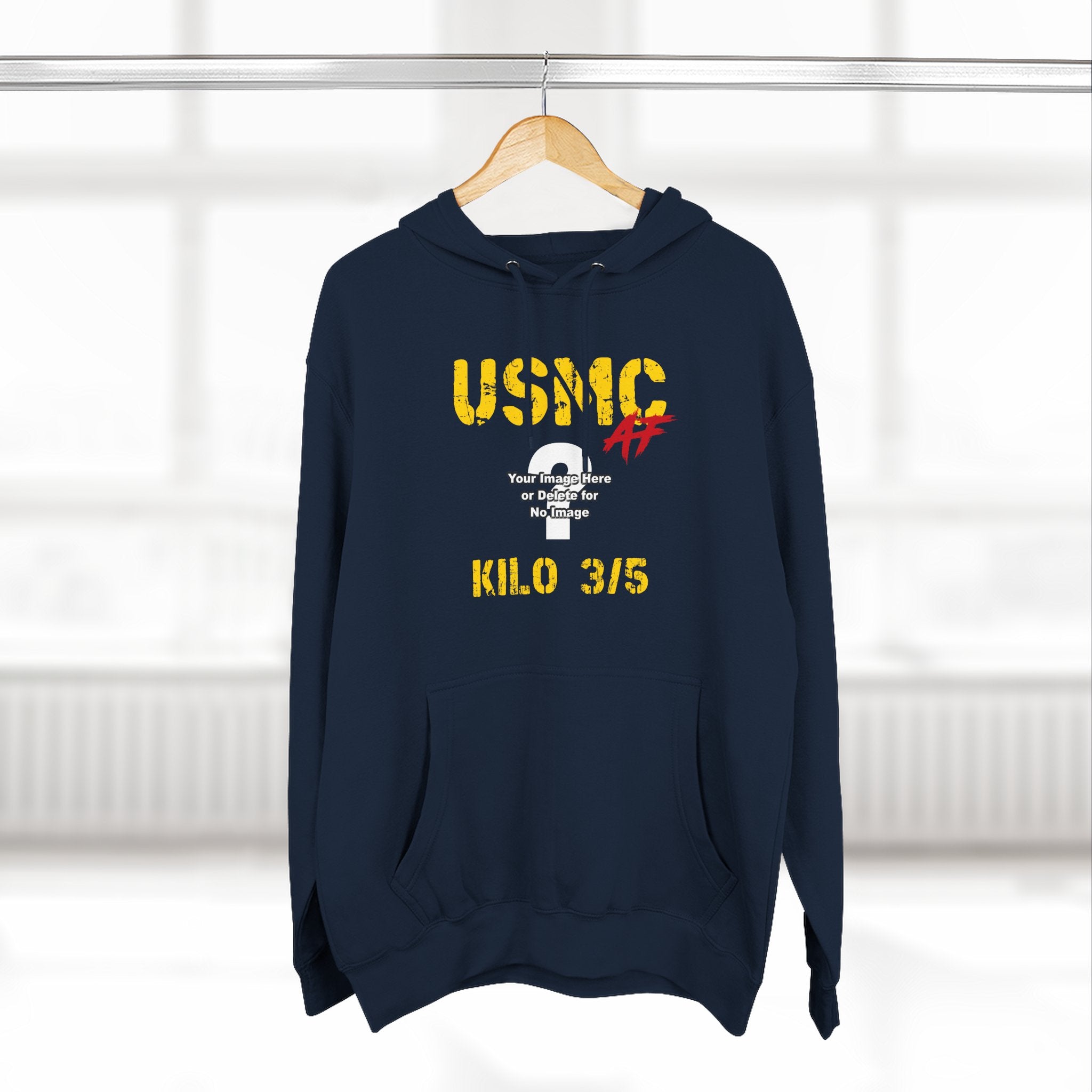 Personalized USMC Marine Corps AF hoodie in Navy on a wooden hanger in a bright room